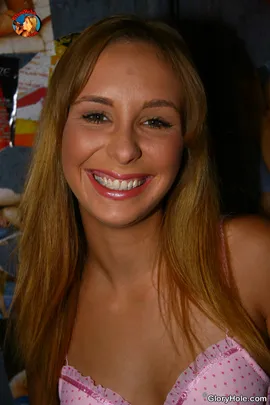 he nervous smile on Laila's face indicates that she might be in over her head.  Laila must have known her bathroom experience wouldn't be normal based on the vile pictures taped on the wall. Toss into the mix that this stall hasn't seen a mop, and you get the complete picture. Laila is a naive blonde that has no idea that lurking behind the other wall is a meaty, black cock with her name on it. While sitting on the stall , Laila uses the few minutes of privacy to treat her white pussy to her freshly manicured hands. The hole in the wall soon gets occupied by a black cock so huge, she thought they only existed in fantasy land. Her face soon shows the expression of curiosity as she inspects his black bazooka before swallowing as much of it as she can. The gagging noises that come from her mouth indicate that she's a white girl who knows what she loves. She even treats his hefty nut sack to a massage with her tongue which brings on further stiffness to his black pecker. Laila's mouth gets a tsunami of black ghetto sauce which she swallows with pride.