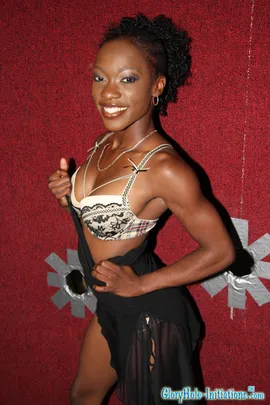 You like strong girls?  Today we have a hardbody black chick who could probably kick your ass.  Meet Justice Jade.  She is one nasty little slut.  She jumped on that white cock as soon as it popped through the hole.  And boy can that girl suck.