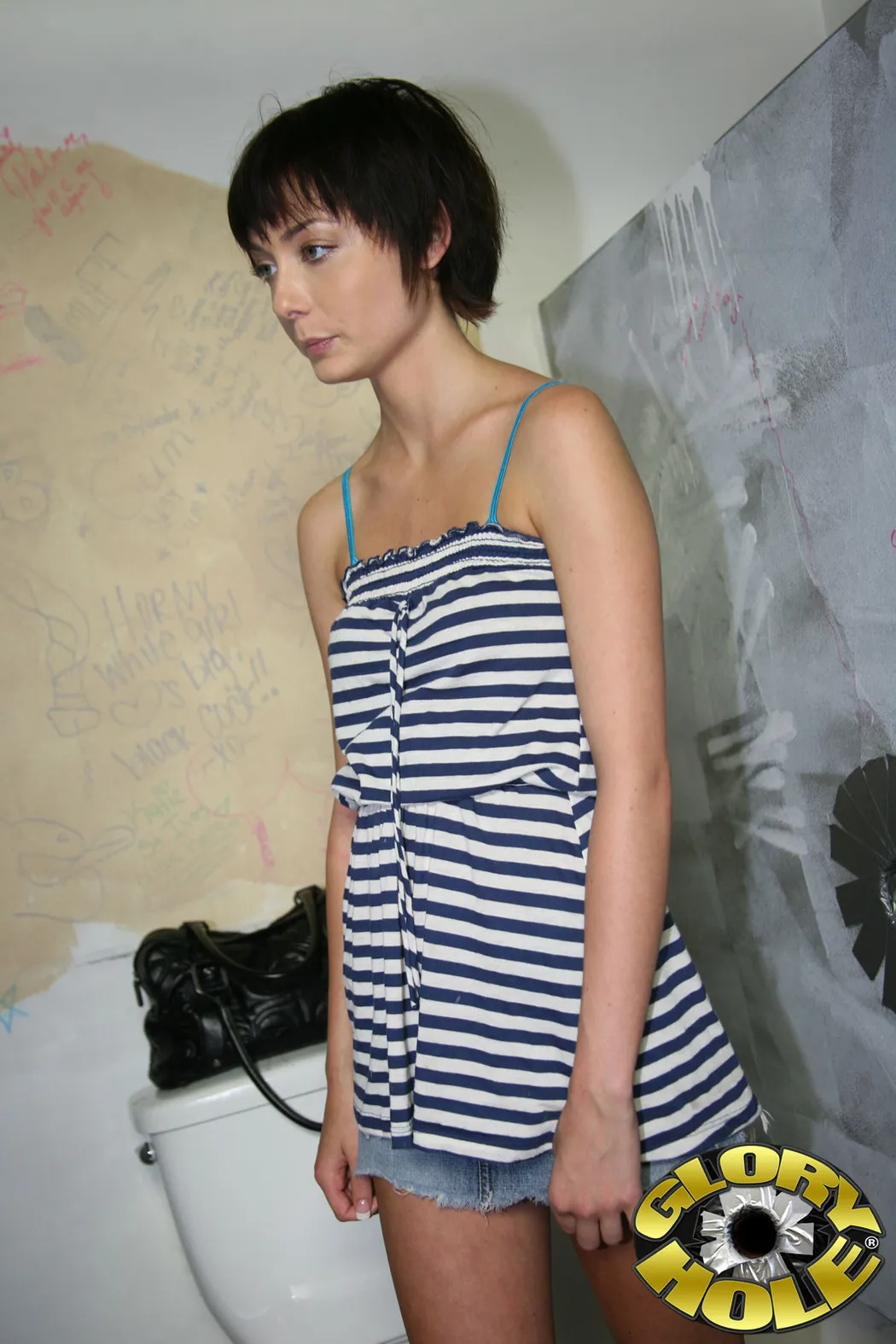 There are some girls that are obvious sluts by how they carry themselves. Zoe Voss isn't just a slut-she's a black cock junkie/slut/slut/aficionado. Her trance-inducing eyes, her unimpaired physique, those legs, and, above all, her willingness to fuck in public make her the perfect candidate for the gloryhole. Her local gas station shoots out more than gasoline-it's the home where anonymous black cocks shoot out ghetto seed at white girls. After getting the key to the stall a.k.a block cock heaven, Zoe settles in for an interesting afternoon which will see her getting her first black cock. Her computer has hundreds of interracial porn clips on it and now it's her turn to take that plunge. Zoe lays the bait down in the form of her naked frame and by fingering her cream box. Her sweet pussy juices have the aroma of a delicate flower that has yet to get plucked. Zoe's moans attract the attention of either a customer, gas station attendant, or even a drifter. The only thing that matters is that his cock is big and black and it finds residency in her mouth. Zoe's lips touch the filthy wall as she manages to deepthroat the luckiest black man in the World. Her shiny eyes light up as she's living out a long awaited fantasy but her pussy has to get in on the action. She lifts her ass up in the air and slid in every inch of black kielbasa. Her pussy gets stretched to the point where her interactions with white guys will be a waste of time. Speaking of waste, Zoe Voss uses her face and mouth as a landing pad for the spitting black cobra.