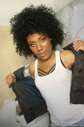 Daquiri Divine didn't get her hair, nails and makeup done just to use this public restroom. She has a date with her first white cock thanks to the wonders of an online search. The circles she hangs out in have told her wild tales of this interracial gloryhole where big, white cocks grow like watermelon. The wetness in her panties can only mean that this black girl is ready for less talk and more interracial fucking. The devilish grin she's sporting tells of a black girl wanting, needing, and desiring her first white cock to be through the hole in the wall while ignoring social taboos. Once inside Daquiri rests that amazing booty of hers on a toilet that used to be porcelain white. Her freshly manicured hands dig deep inside her pussy until that g-spot explodes from oure joy. The screaming coming from this divine ebony goddess attracts a beefy white cock which she sucks down as if were the last white cock in the suburbs.Daquiri's shiny black pussy gets
 treated to a white dick drilling courtesy of the cryptic Caucasian behind the wall. With friction causing her pussy to get sore Daquiri Divine drops to her knees to suck down white goo as if it were shots of Hennessey.